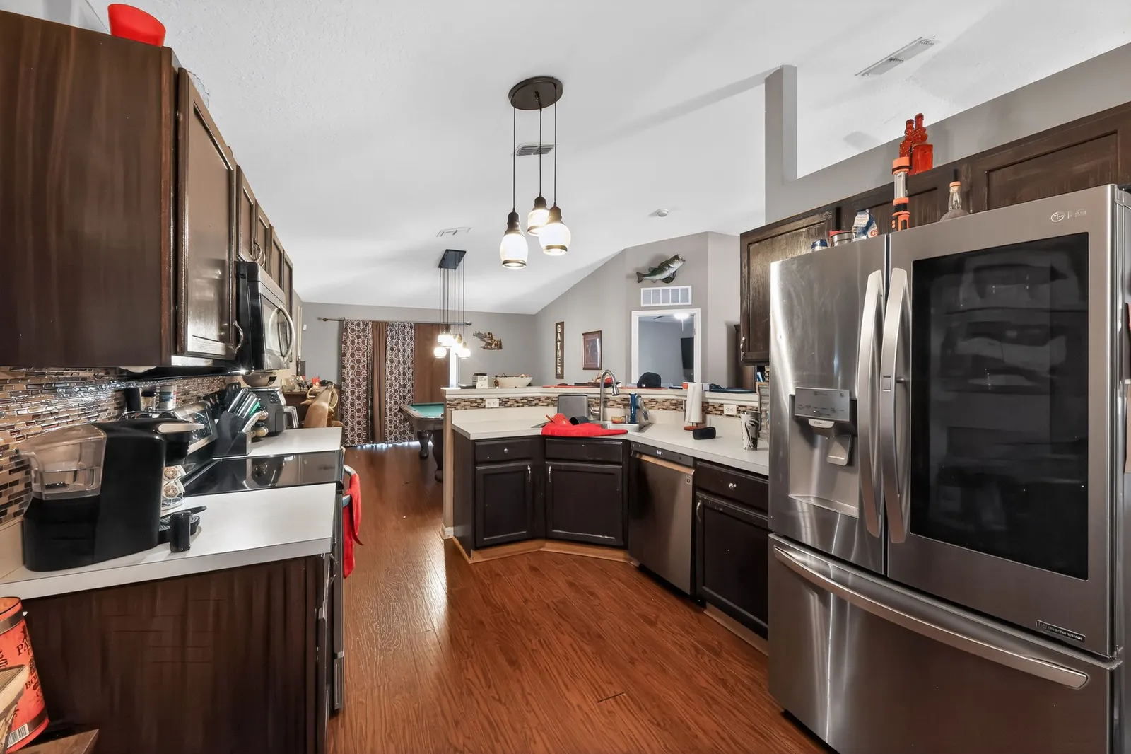 Kitchen with dark cabinets and wood floors in a Winter Haven home
